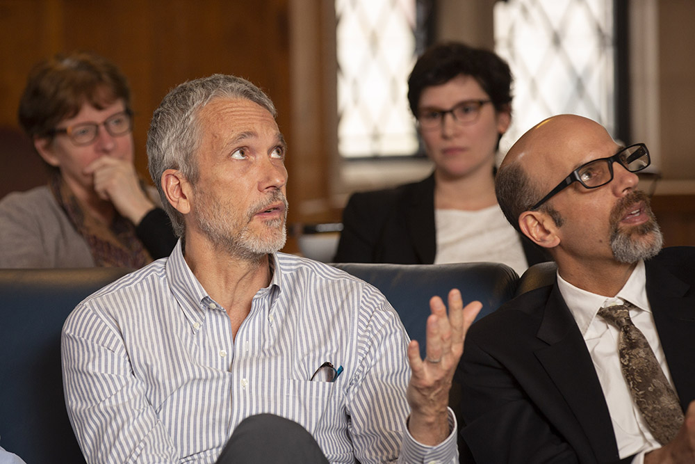 YLS Prof. Ian Ayres &#039;86 asking a question, while YLS Prof. Daniel Markovits &#039;00 listens (foreground)
