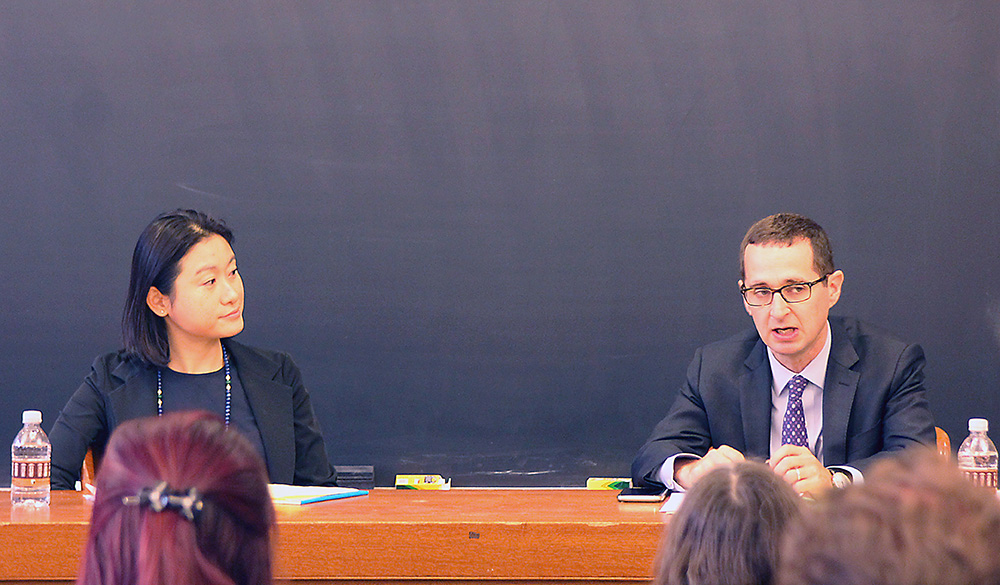 Center Exec. Dir. Nancy Liao &#039;05 listening to Michael Held answer a question that she asked.