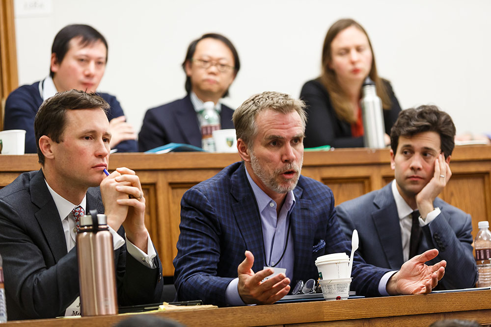 Foreground: YLS Prof. John Morley &#039;06, Columbia Law Prof. Eric Talley, and Wake Forest Law Prof. Andrew Verstein &#039;09; Background: Hongzhi Yu, U. of Hong Kong Faculty of Law Prof. Say Goo, and Amanda Kosonen
