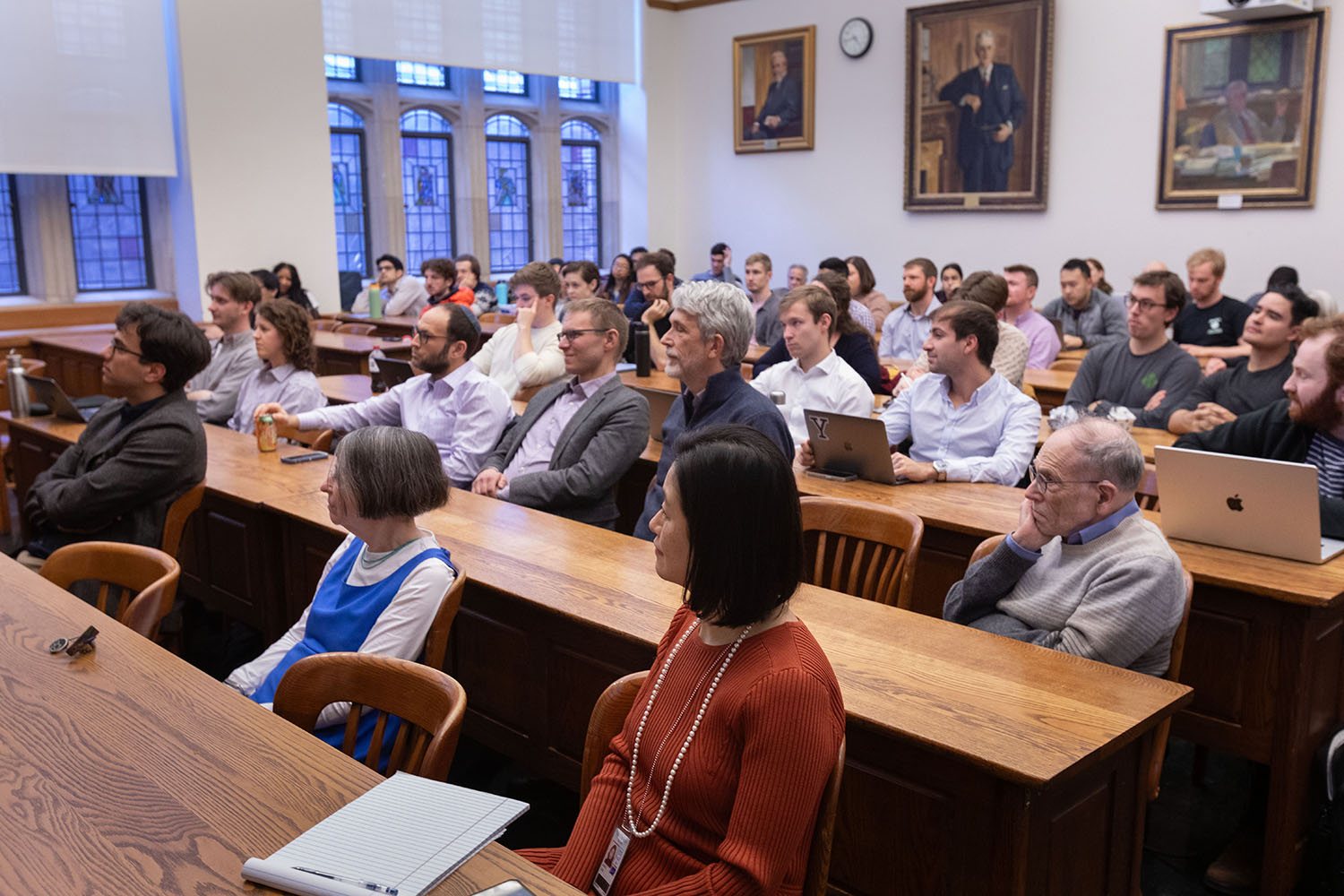 Audience at the 2023-2024 Winter Lecture, including (first row) YLS Profs. and Center Co-Dirs. Sarath Sanga &#039;14 and Roberta Romano &#039;80 and Center Exec. Dir. Nancy Liao &#039;05, and (second row) YLS Deputy Dean Yair Listokin &#039;05, and YLS Profs. Zachary Liscow &#039;15, Ian Ayres &#039;86, and Al Klevorick