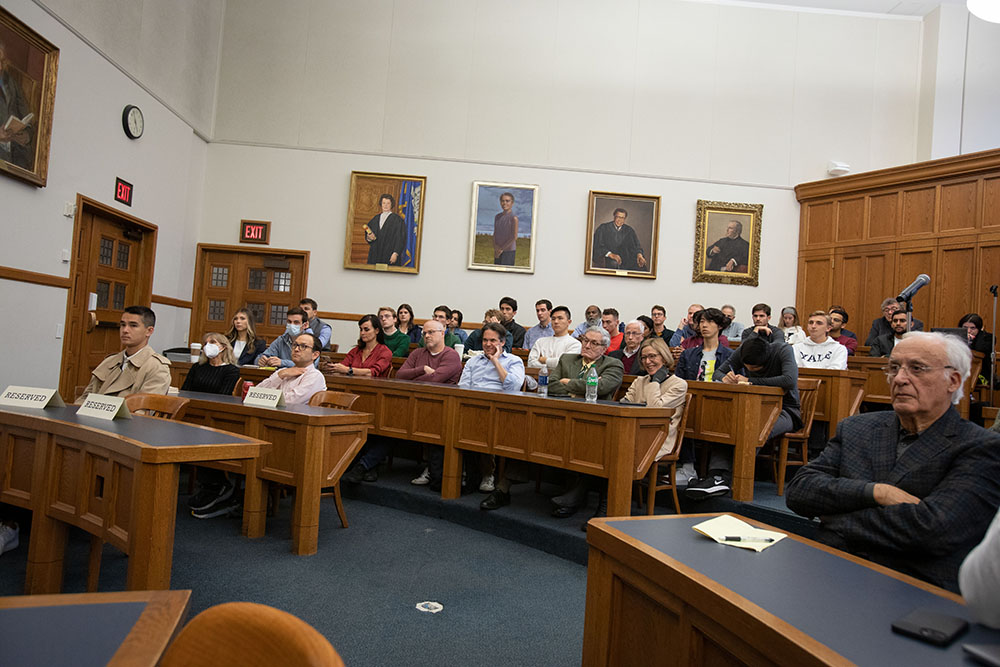 Audience including (second row from the right) YLS Prof. Emeritus Owen Fiss &#039;64, YLS Deputy Dean and Prof. Yair Listokin &#039;05, and YLS Prof. Christine Jolls; (third row from the right) YLS Prof. Kate Stith, the Hon. José A. Cabranes &#039;65, YLS Prof. David Schleicher &#039;04, YLS Prof. Gideon Yaffe, and Yale Jackson Senior Lecturer and Assistant Dean for Undergraduate Education Sigrídur Benediktsdottir; and (third row, third person from the right) YLS Prof. Alan Schwartz &#039;64