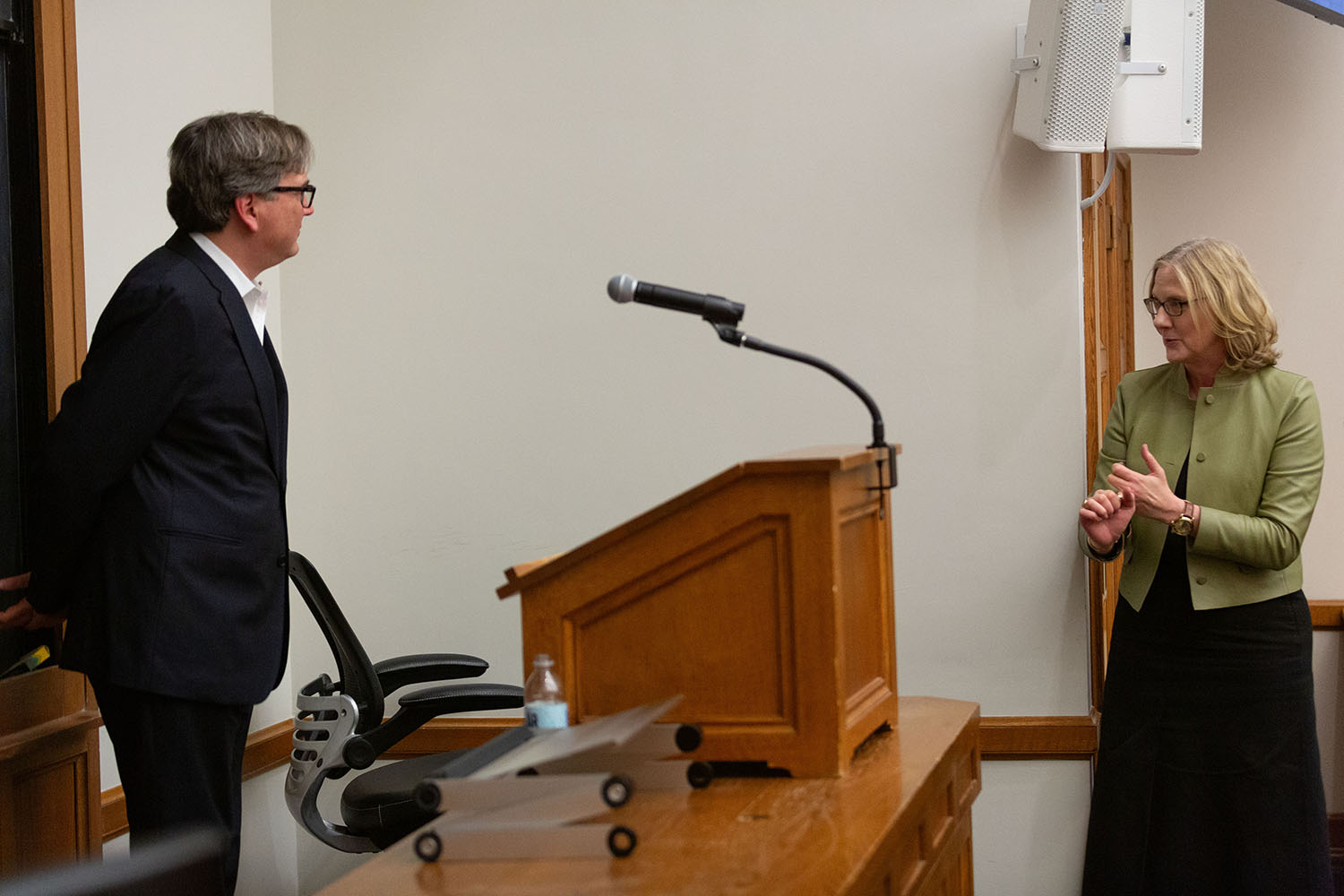 YLS Dean Heather Gerken (right) asking Harvard Econ. Prof. Jason Furman (left) a question