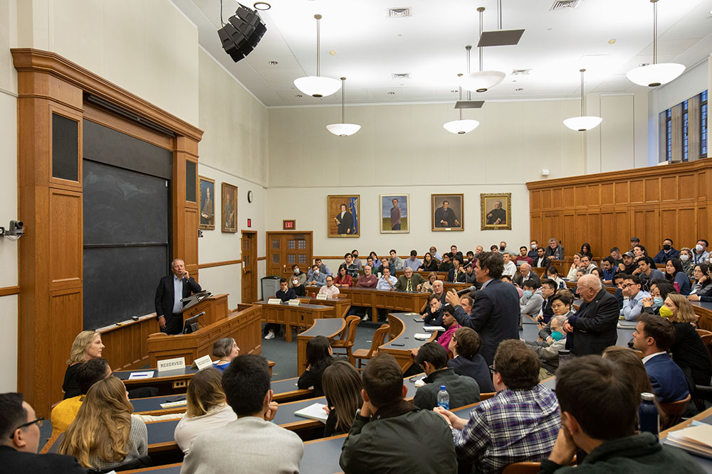 Yale Econ. Prof. John Geanakoplos asking a follow-up question, while 2022-2023 Winter Lecture audience listens